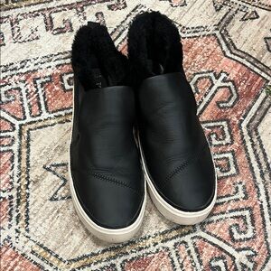 Toms fur lined black leather slip ons